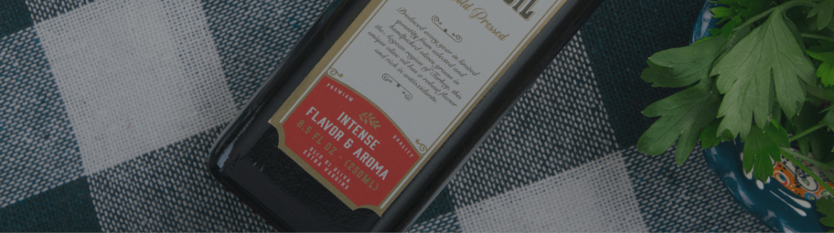 Artem-Oliva-Extra-Virgin-Olive-Oil-in-Marasca-Bottle-CloseUp-Shoot-to-Label-min.png