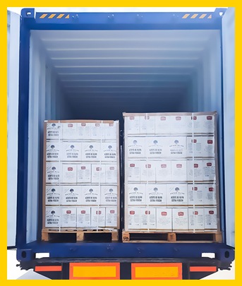 Artem Oliva olive oil products securely packed in a shipping container, ready for international transportation and delivery.